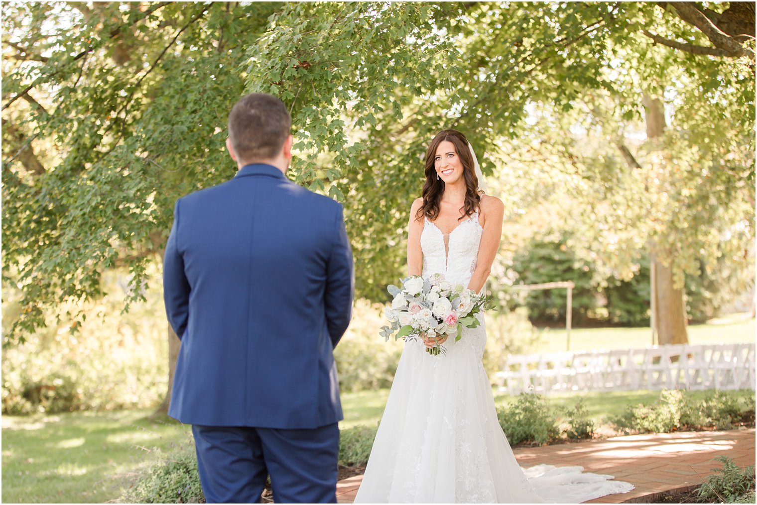 bride walks up to groom during first look on NJ wedding day 