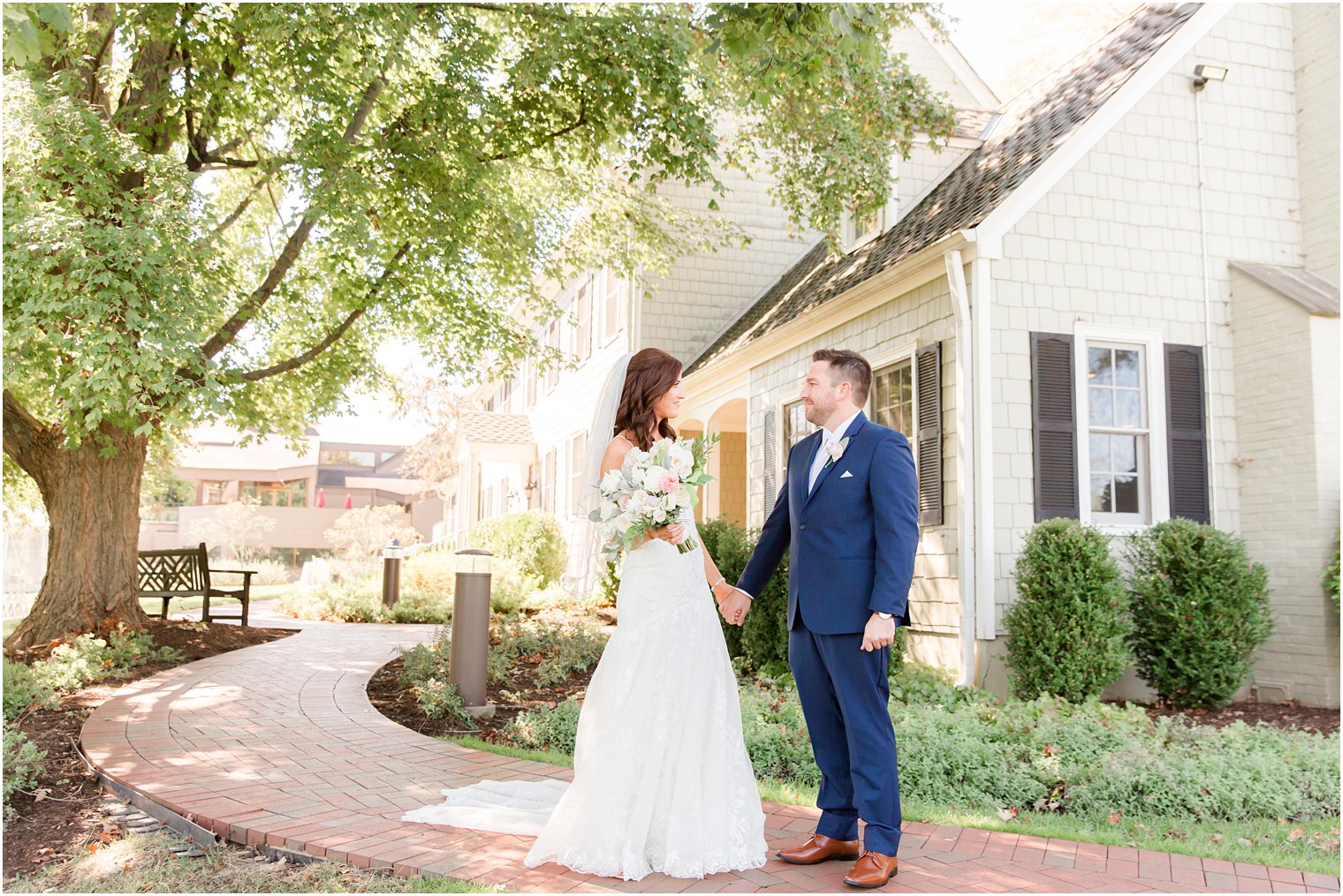 newlyweds smile together during first look in Princeton NJ 