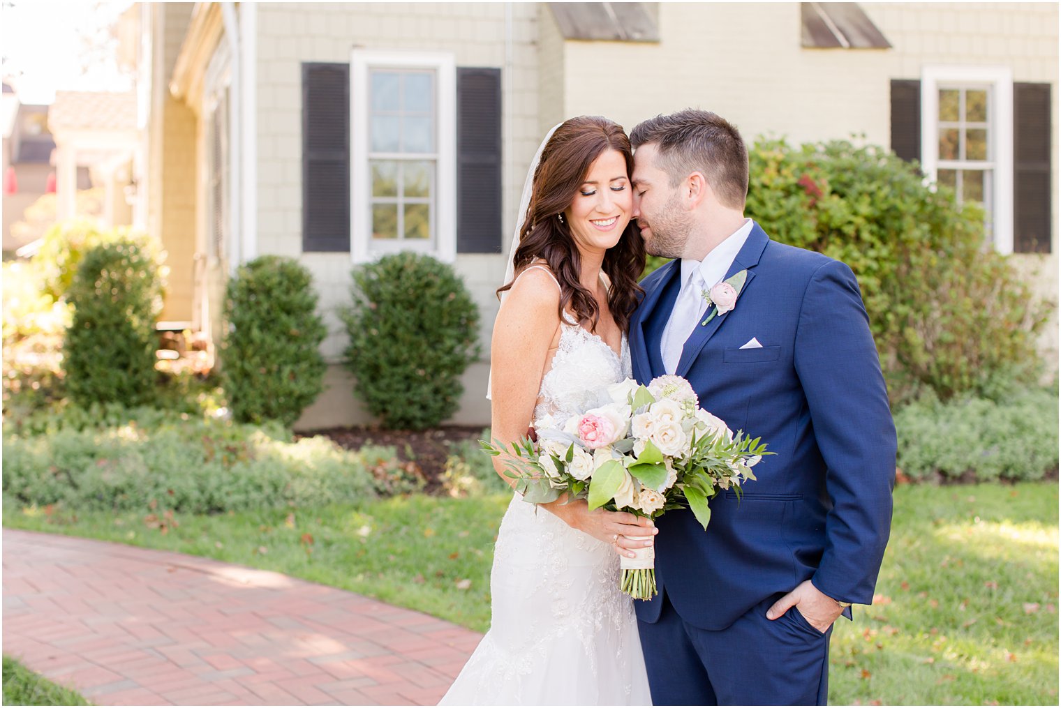 groom nuzzles bride's cheek during Chauncey Hotel wedding portraits 