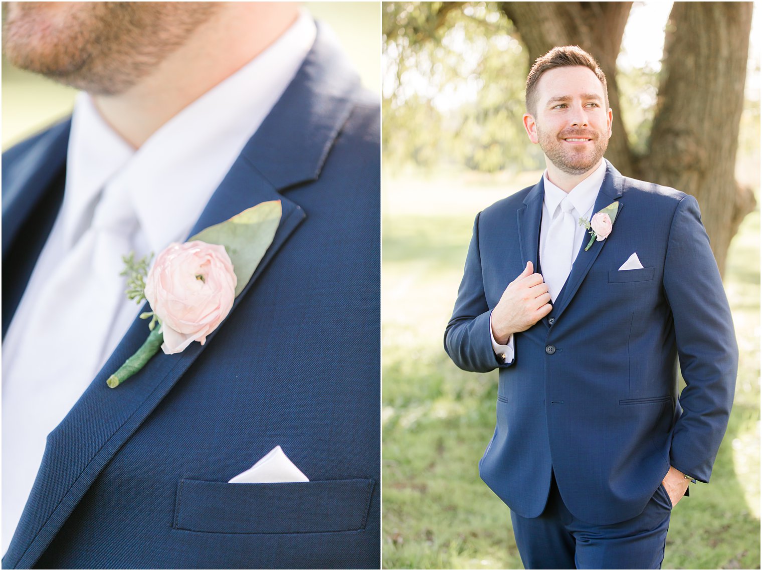 groom holds lapel of navy suit with pink boutonniere 