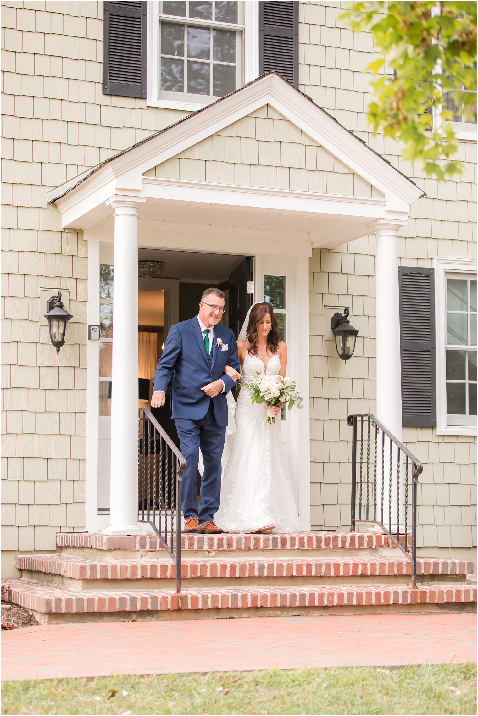 bride and dad walk out of the Chauncey Hotel