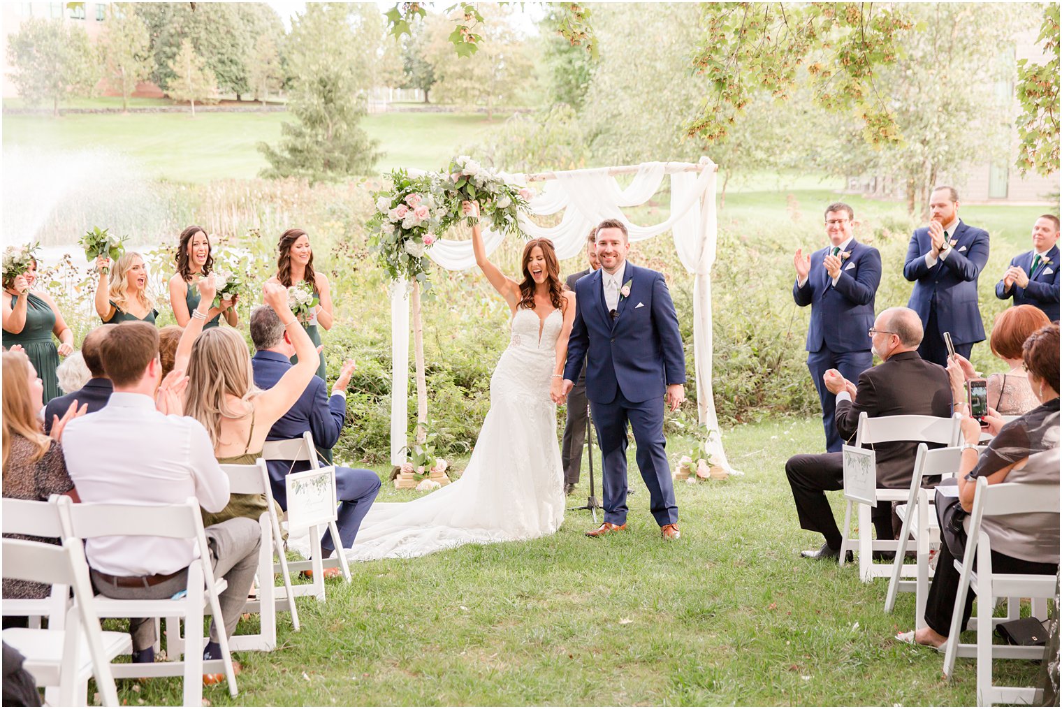 bride cheers after Chauncey Hotel wedding ceremony 