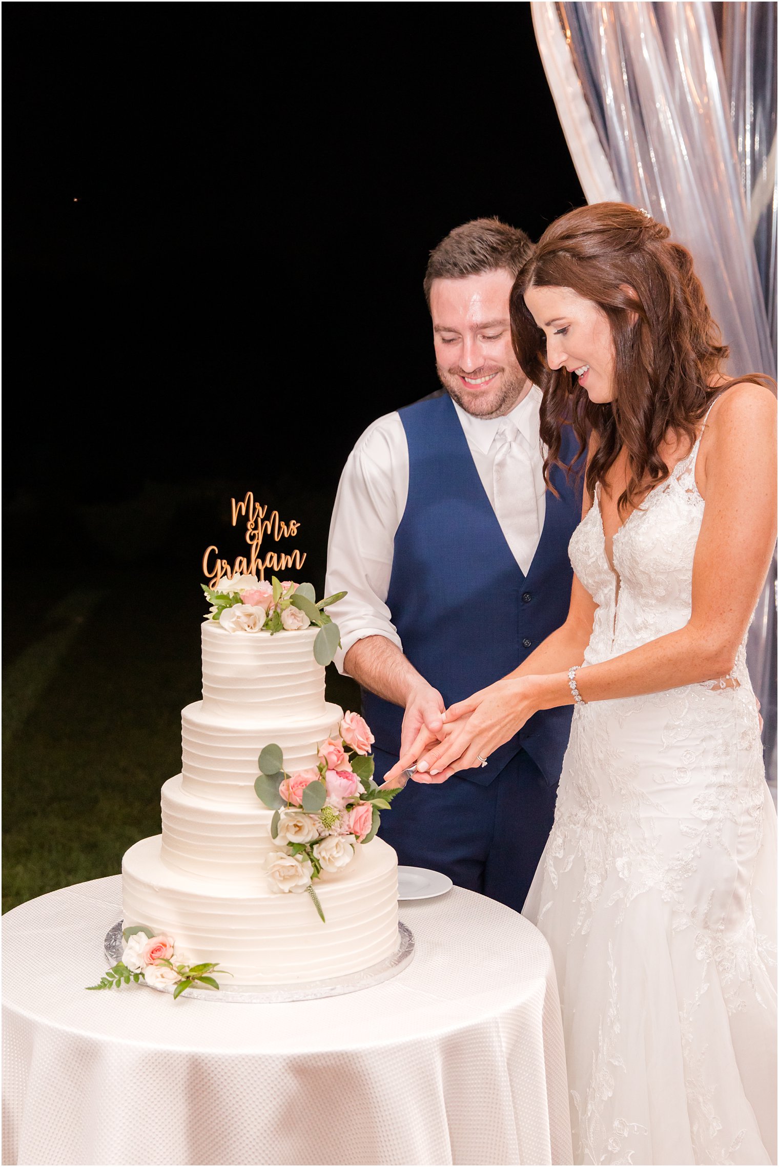 newlyweds cut wedding cake during Princeton NJ wedding reception
