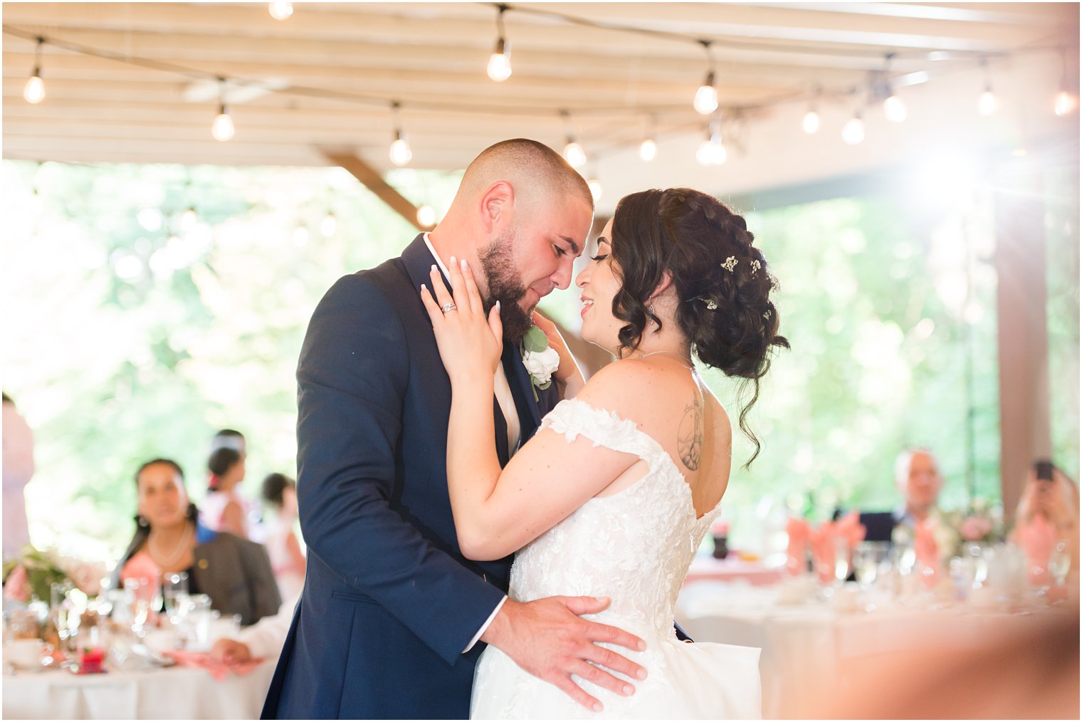 newlyweds dance together during Rutgers Gardens wedding reception 
