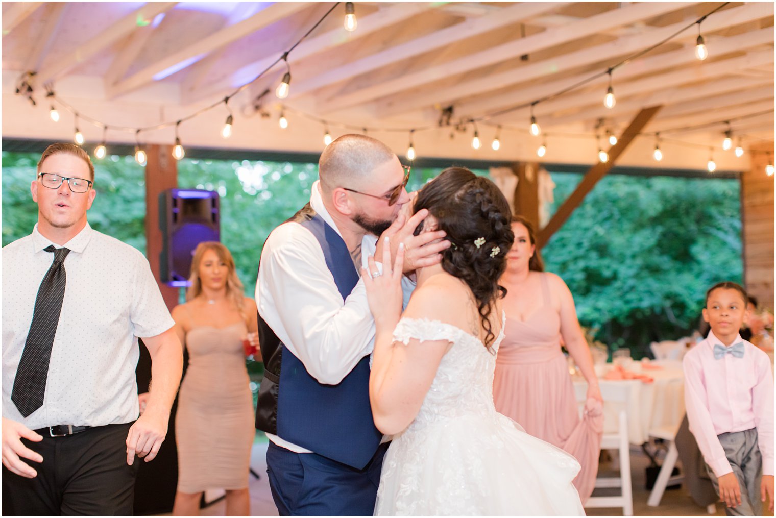 bride and groom kiss on dance floor during NJ wedding