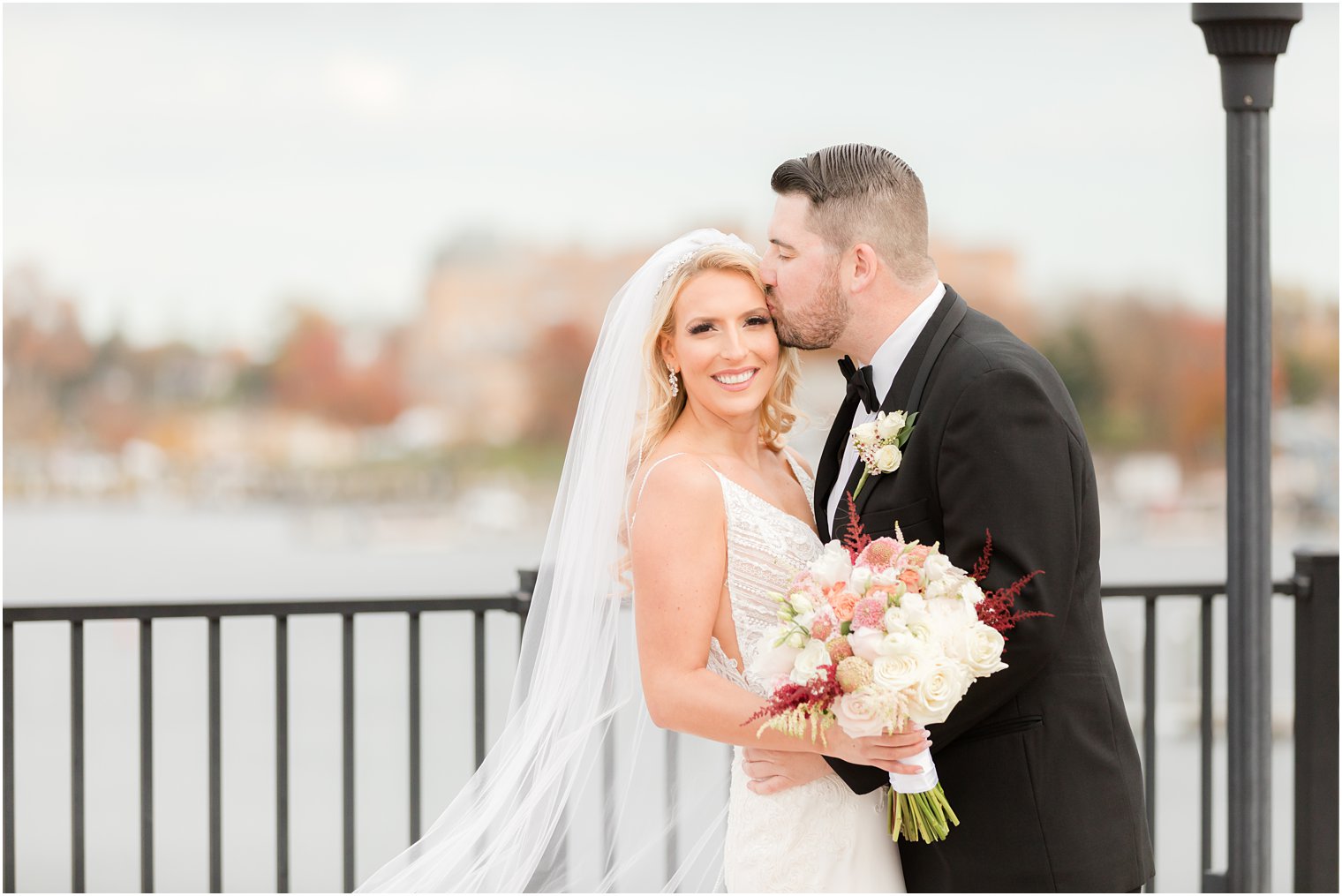 groom kisses bride's forehead in Red Bank NJ