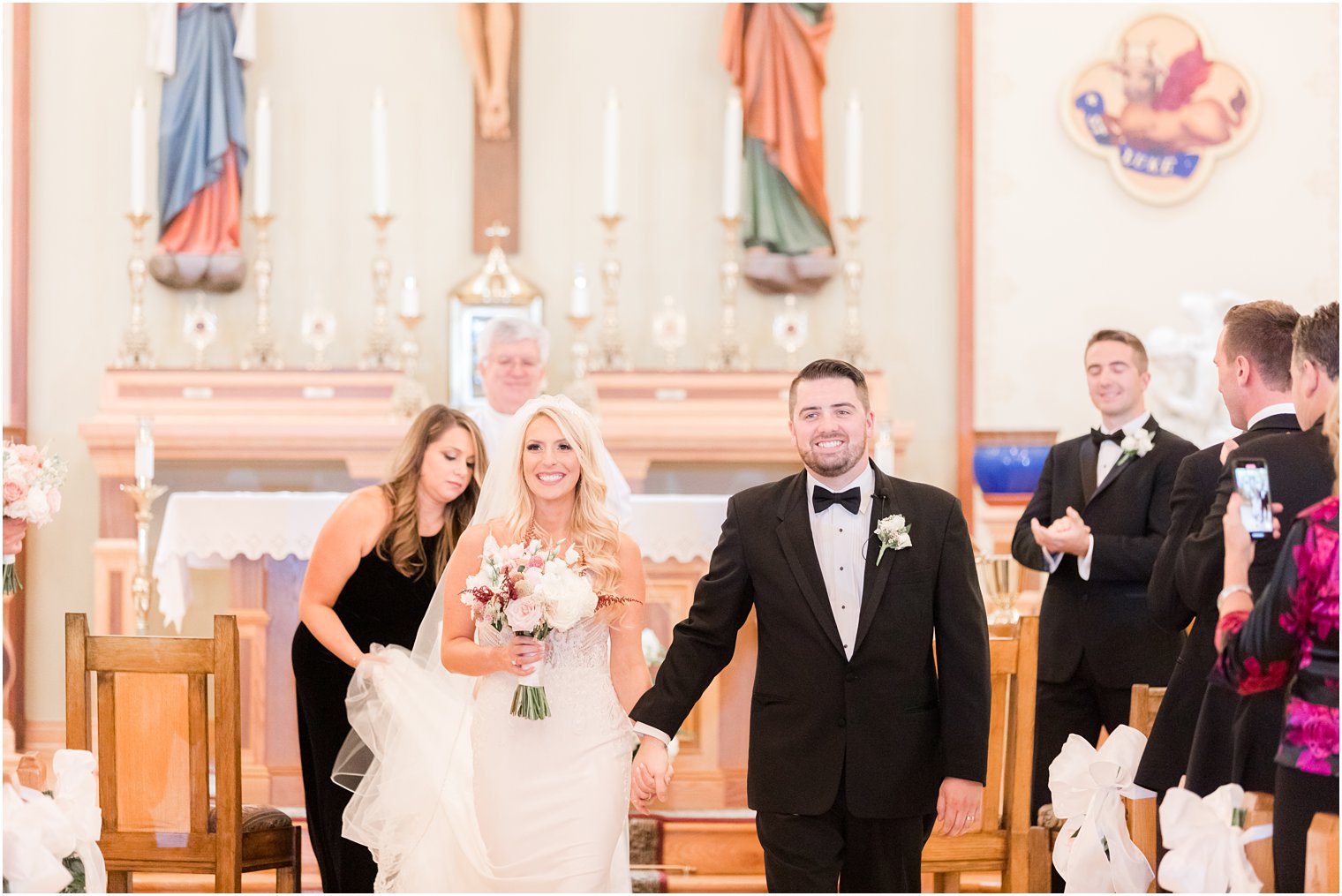 bride and groom walk up aisle after church wedding ceremony in Red Bank NJ