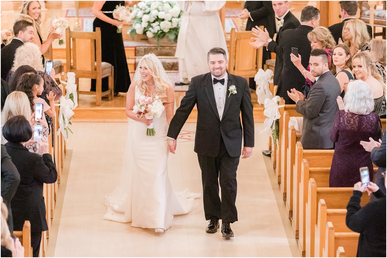 bride and groom leave church wedding ceremony in New Jersey