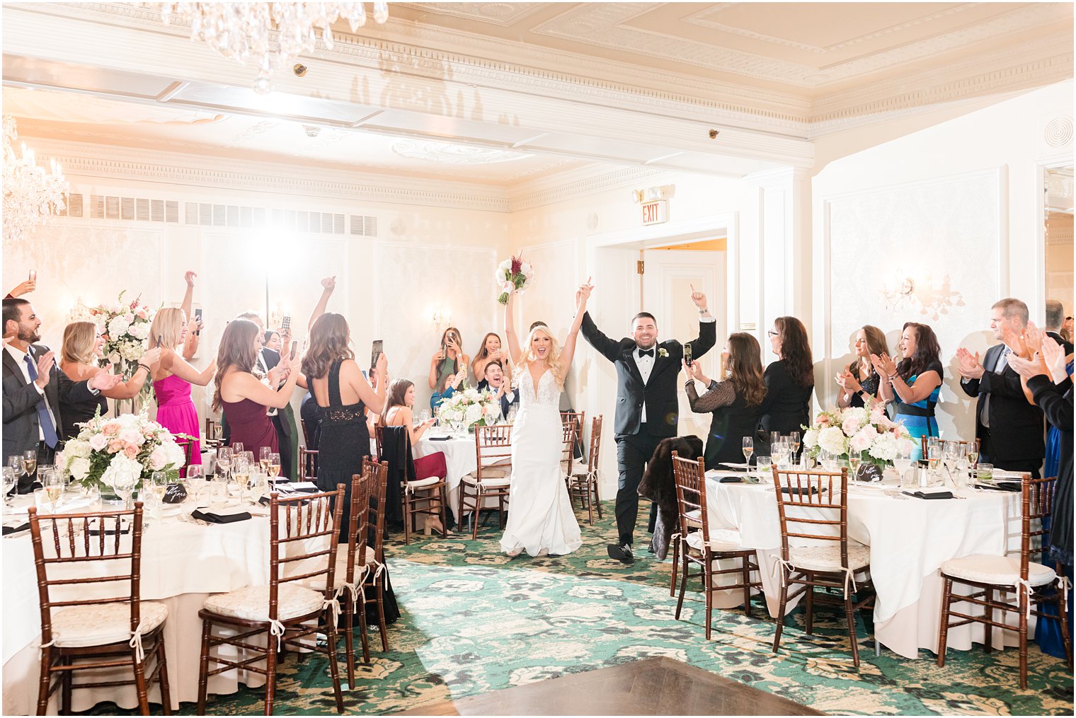 newlyweds cheer entering wedding reception at Molly Pitcher Inn