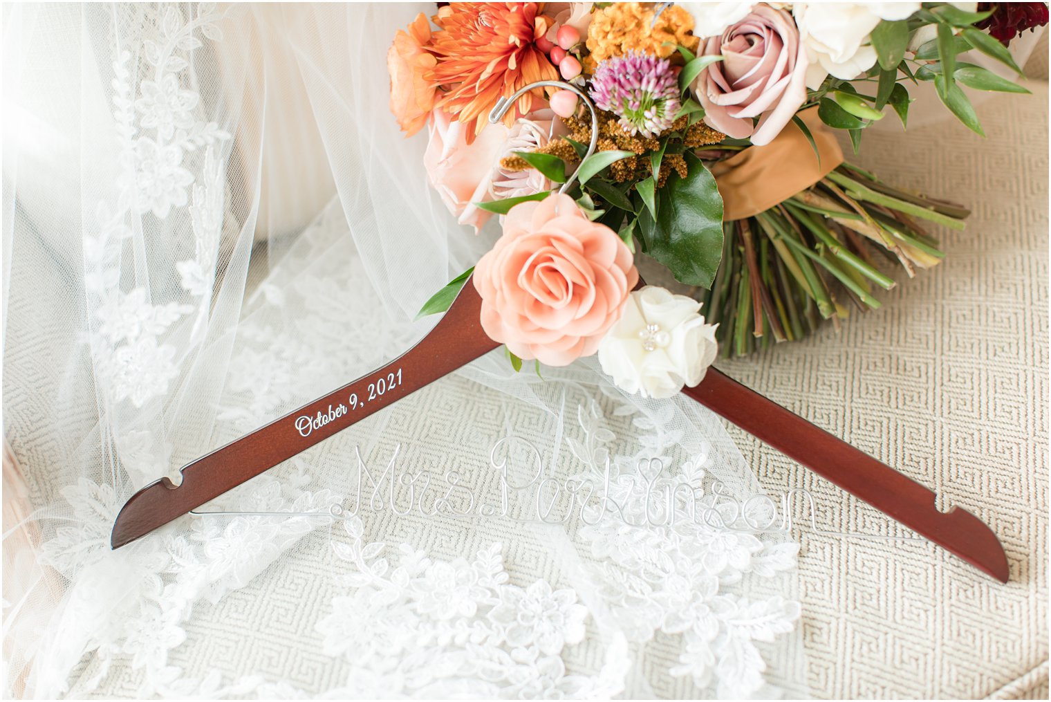 bride's custom wooden hanger for wedding gown