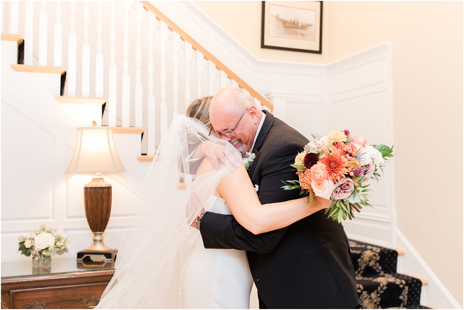 dad hugs daughter during first look on wedding day