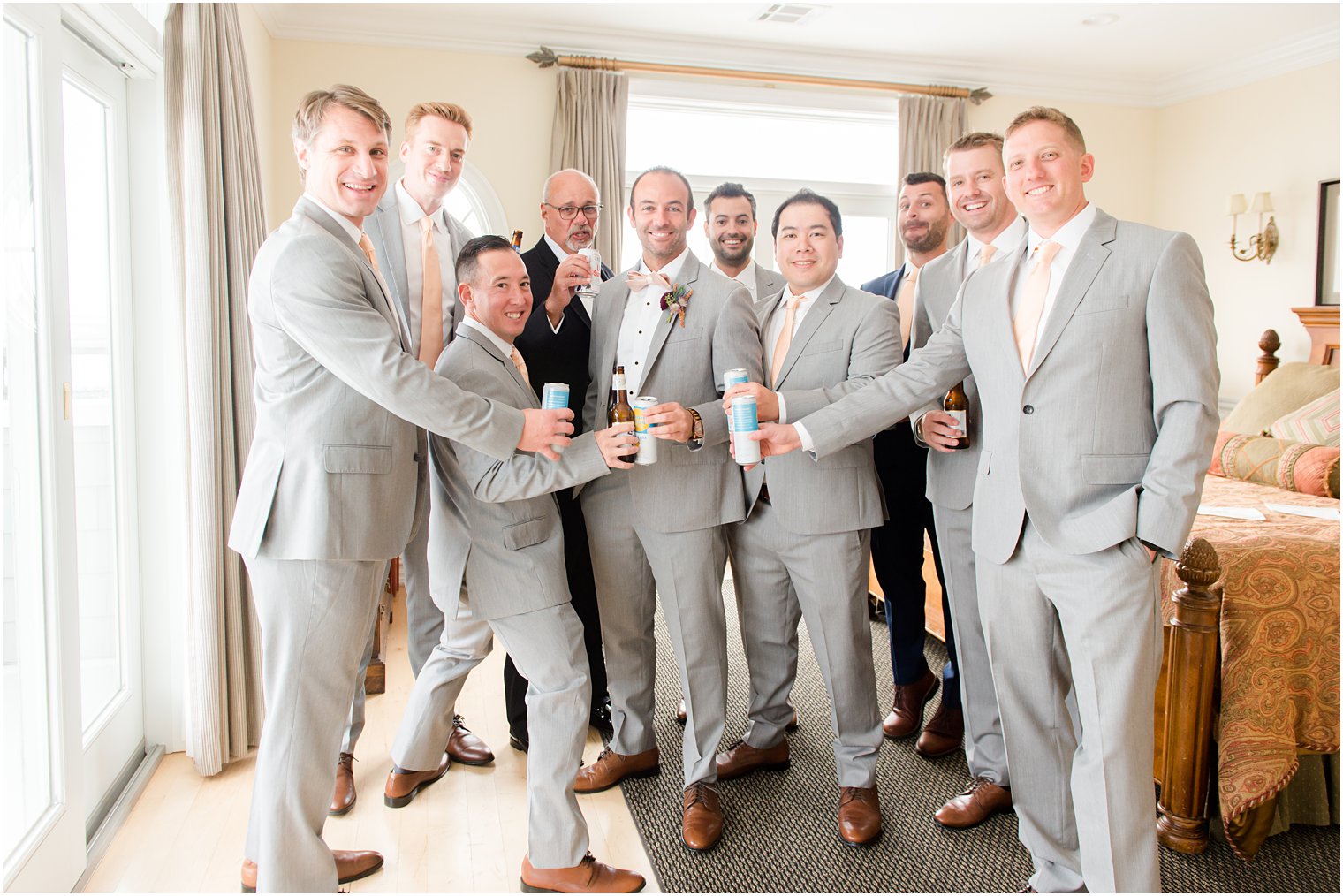 groom and groomsmen toast during NJ wedding day