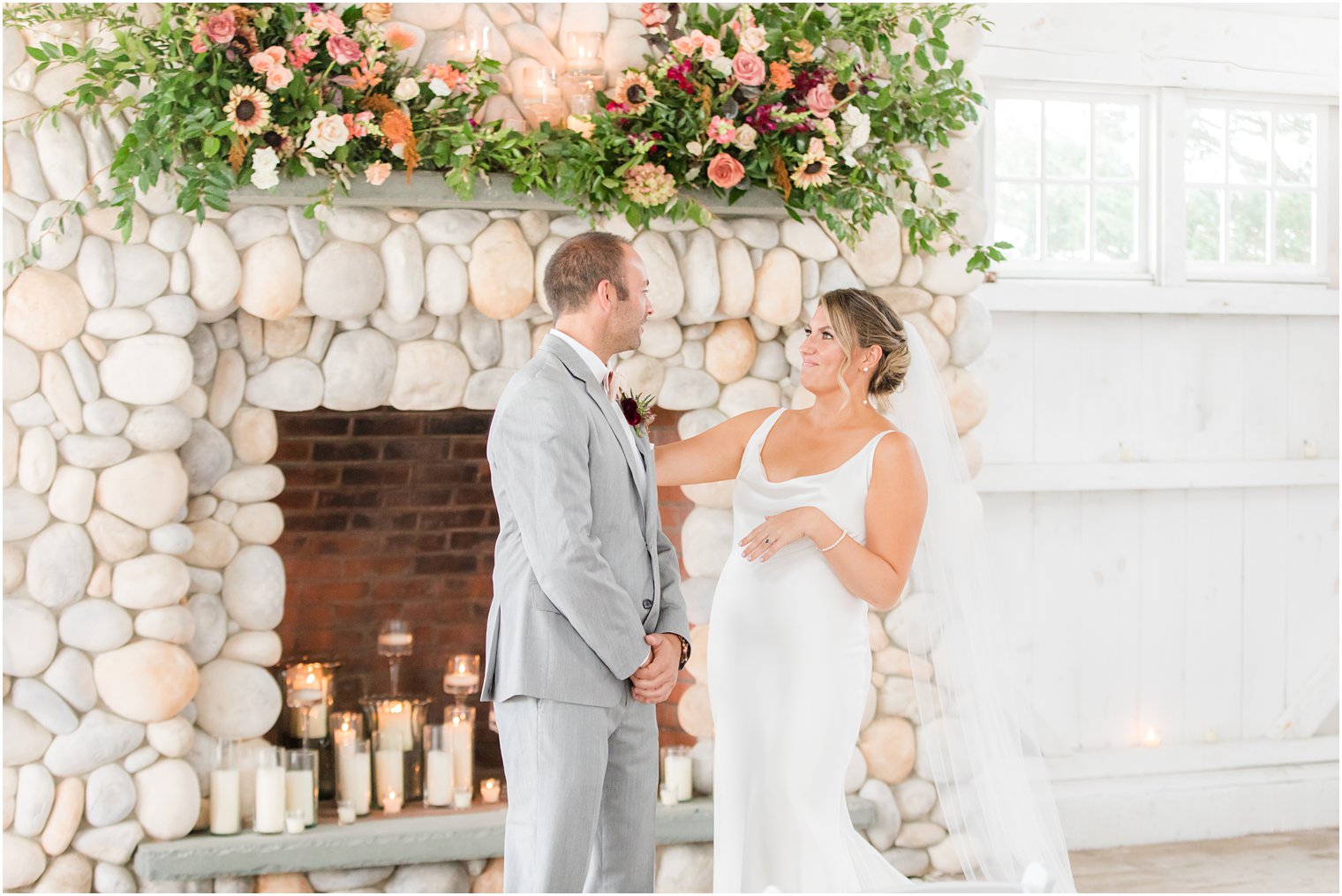 bride and groom smile during first look at Bonnet Island Estate