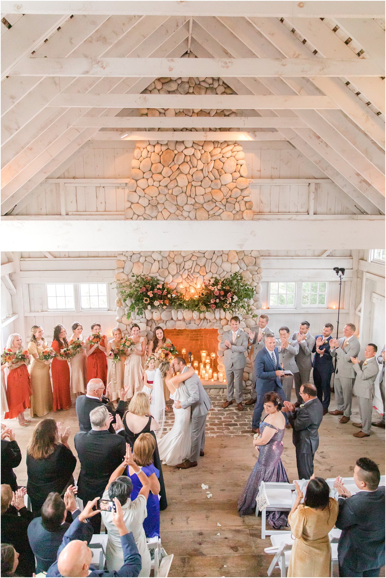 bride and groom kiss during wedding ceremony in Manahawkin NJ