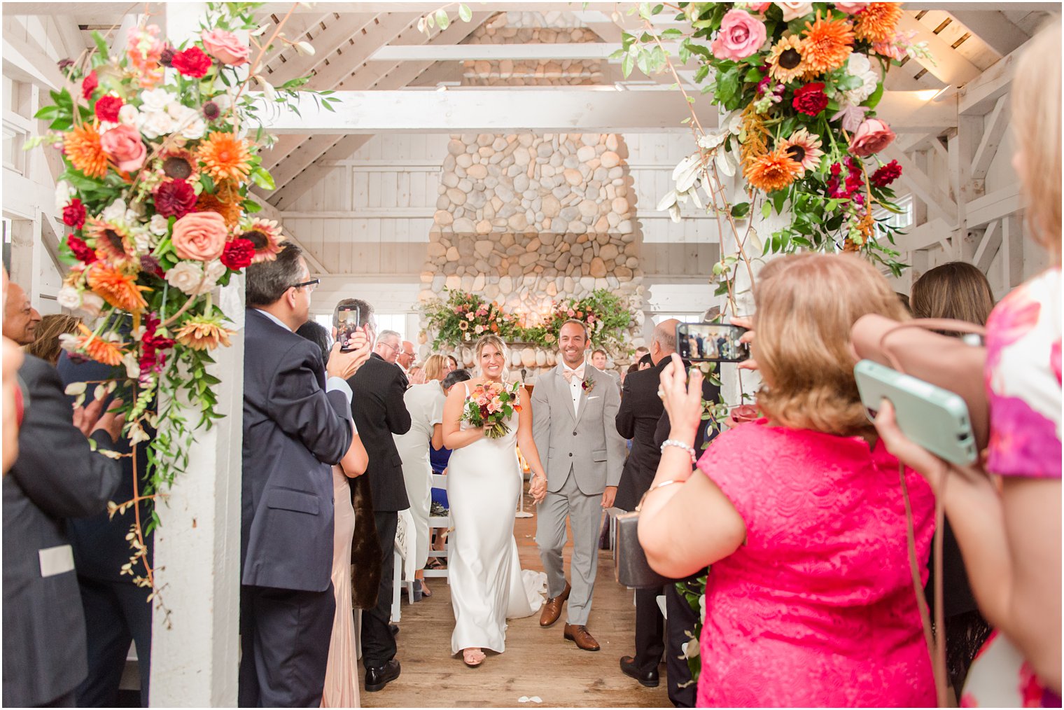 bride and groom walk up aisle after wedding ceremony in Manahawkin NJ