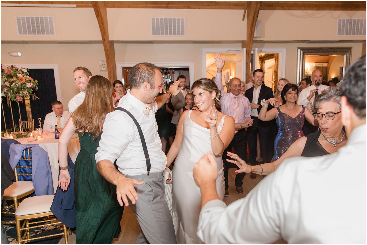 newlyweds dance together during NJ wedding reception at Bonnet Island Estate