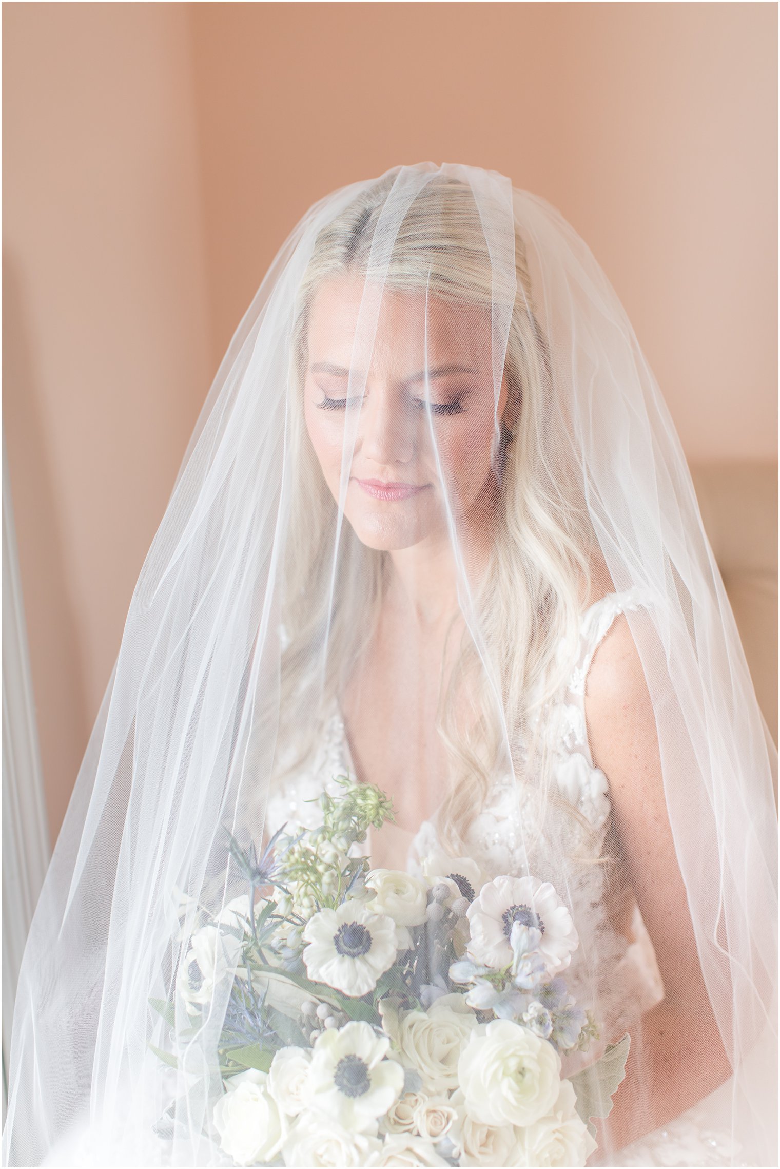classic bridal portrait of bride under veil in bridal suite at Brant Beach Yacht Club