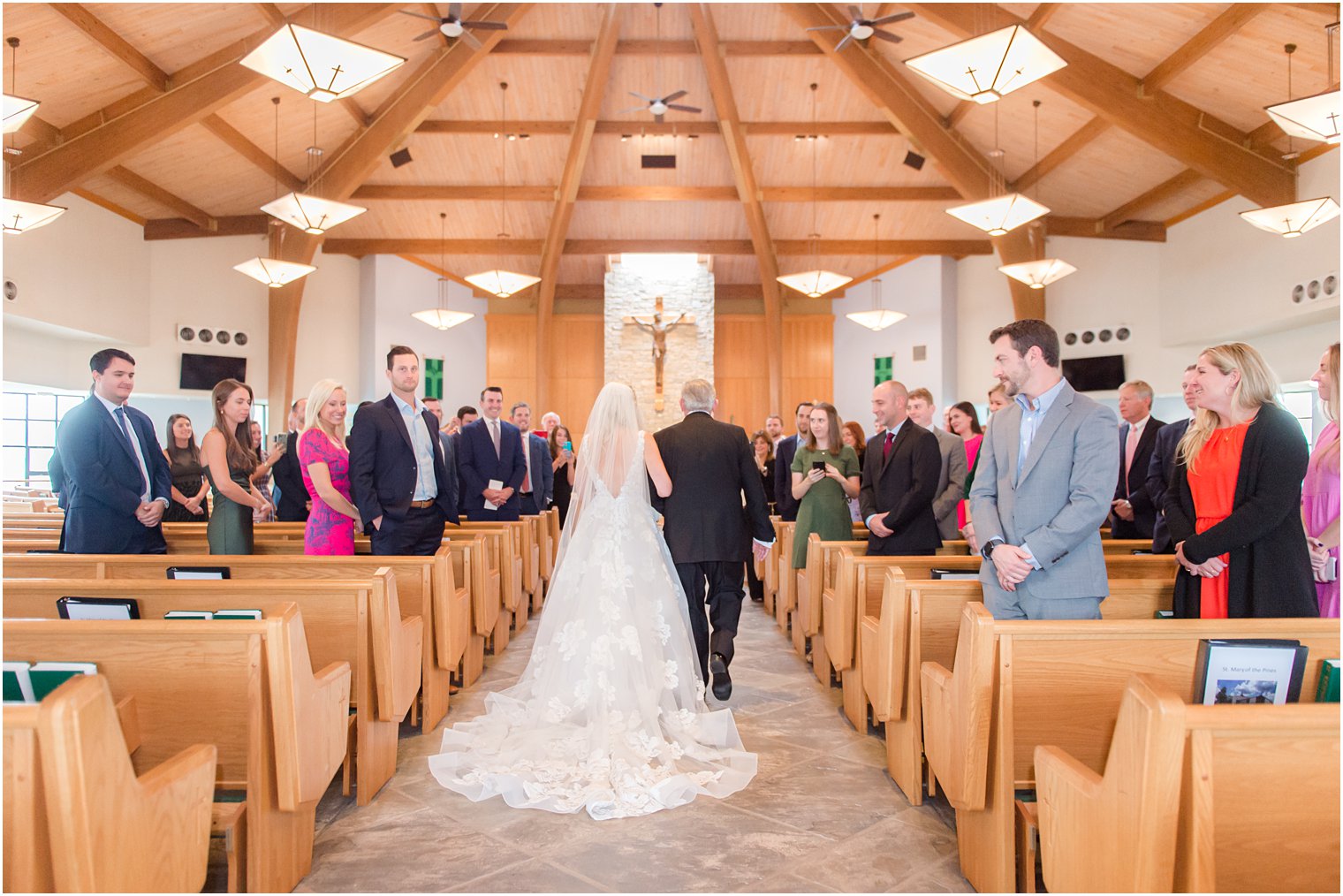 bride walks down aisle with dad for traditional church wedding in New Jersey