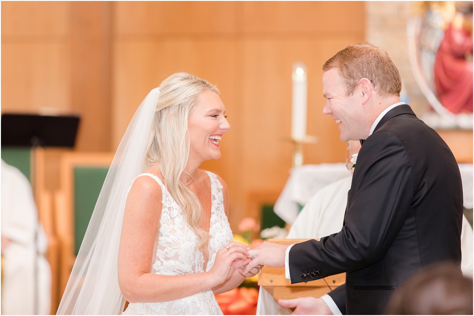 bride and groom laugh during traditional church wedding in New Jersey