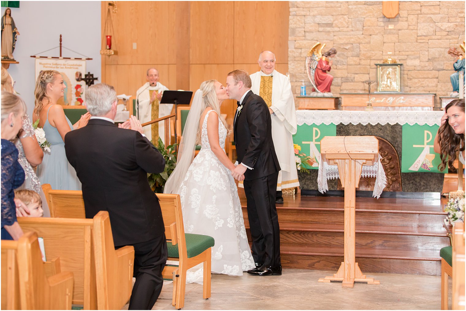 bride and groom kiss after traditional church wedding in New Jersey