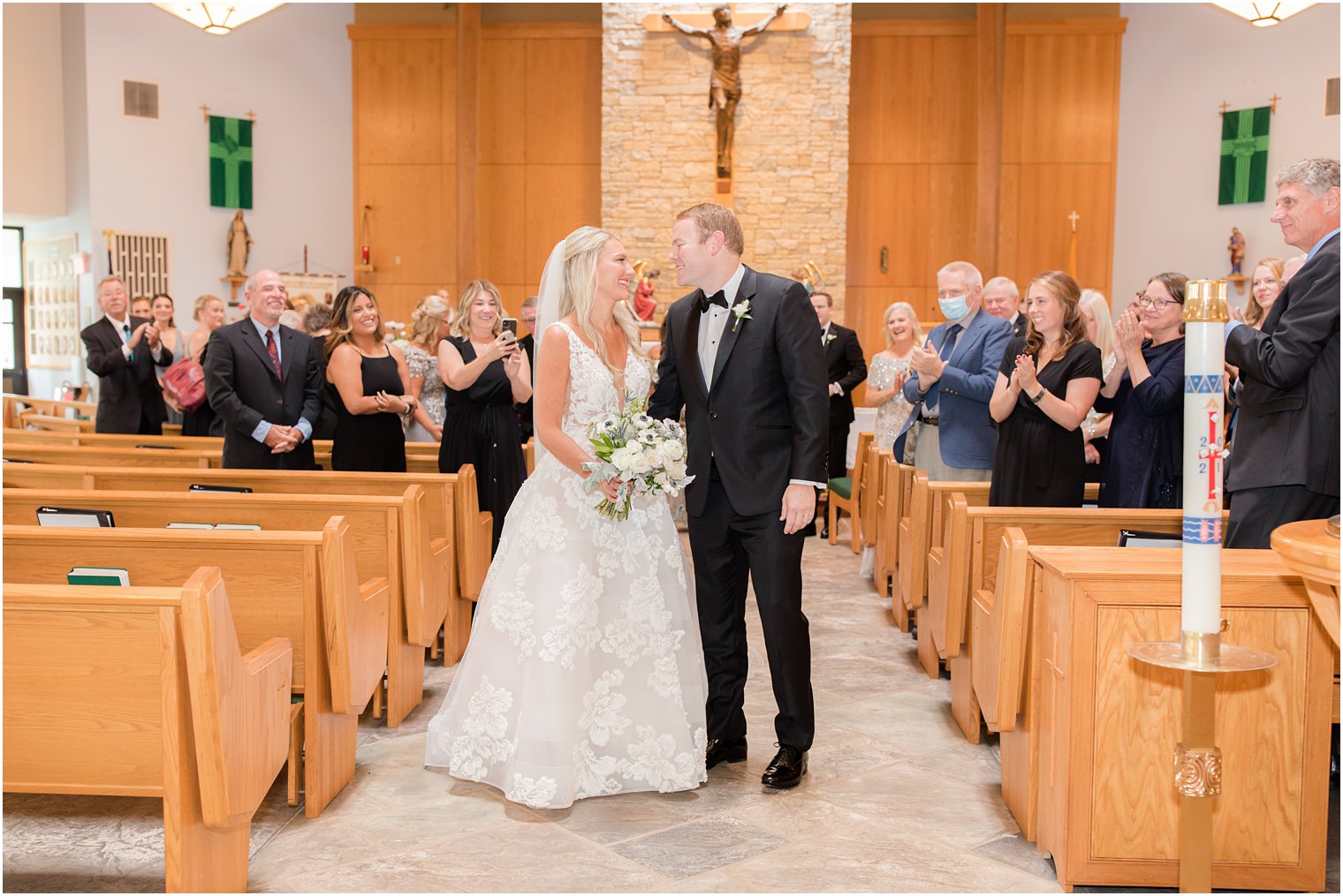 bride and groom walk up aisle during traditional church wedding in New Jersey