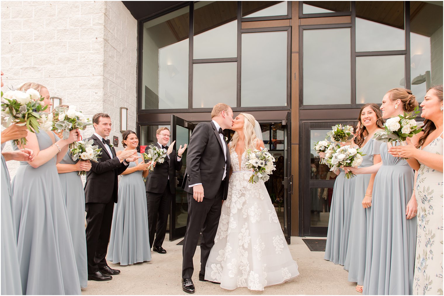 bride and groom kiss outside church in New Jersey 