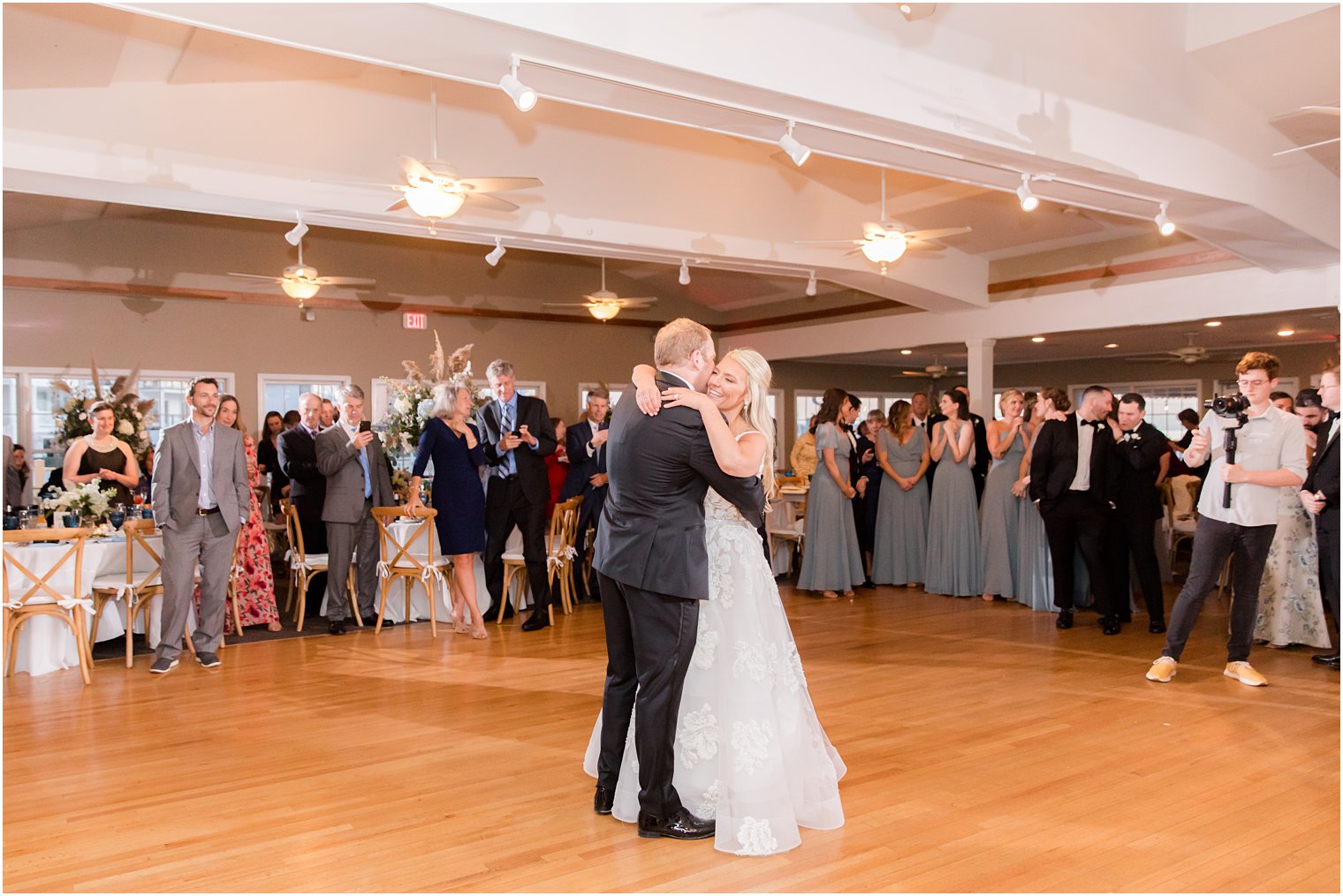 bride and groom hug on dance floor in New Jersey 