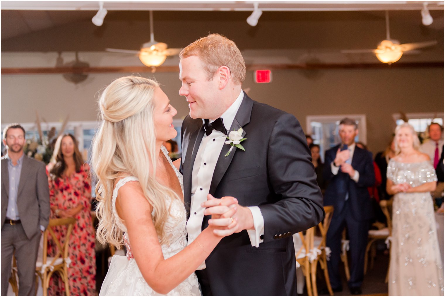 bride and groom smile at each other during first dance in New Jersey 