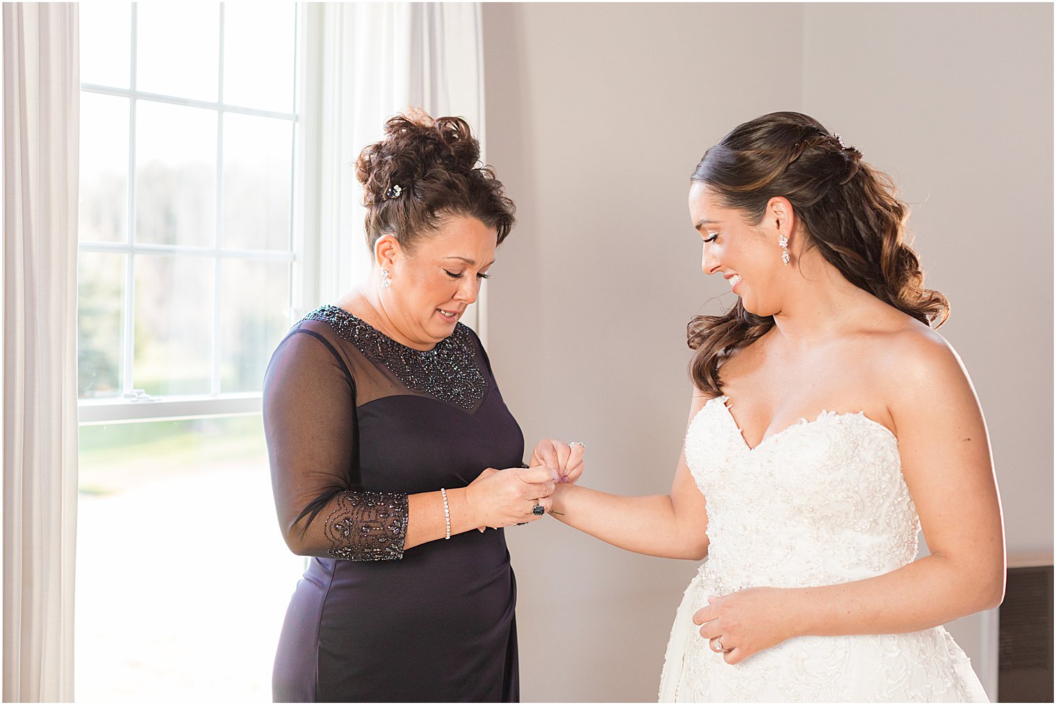 mother adjusts bride's bracelet at Bear Brook Valley