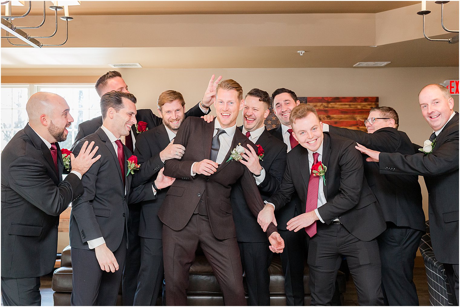 groomsmen hug groom before NJ wedding day