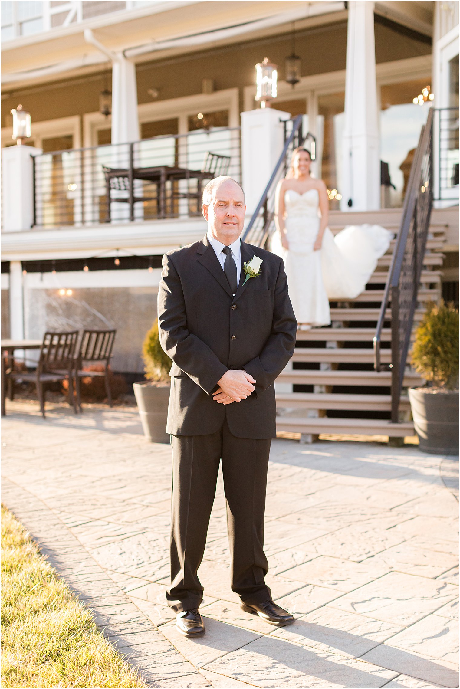 bride walks down steps for first look with dad