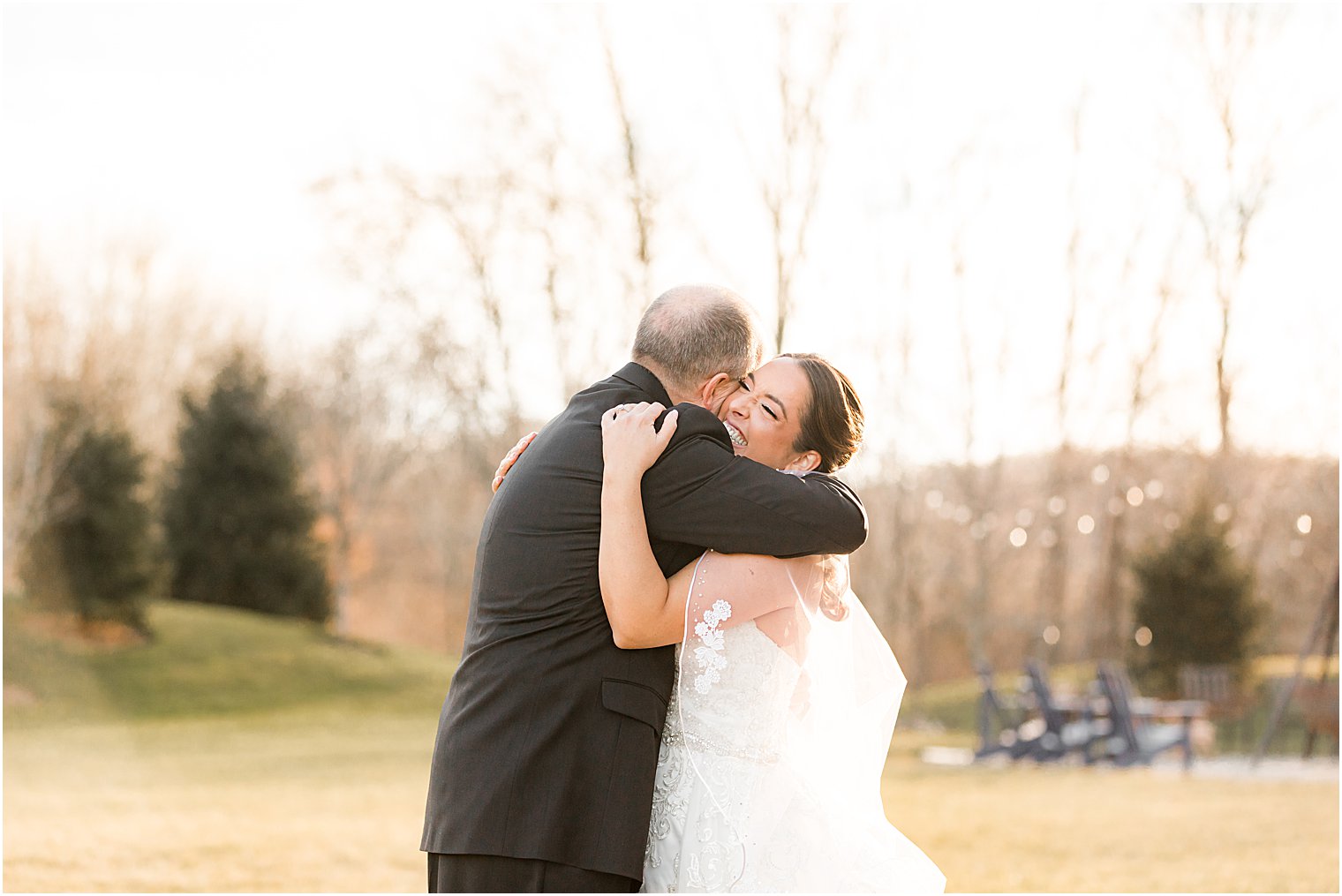 bride and dad hug during first look at Bear Brook Valley