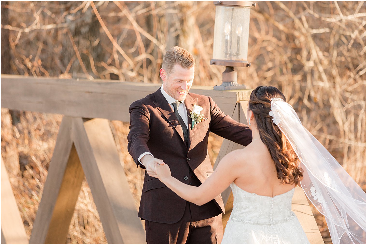 groom looks at bride during first look at Bear Brook Valley