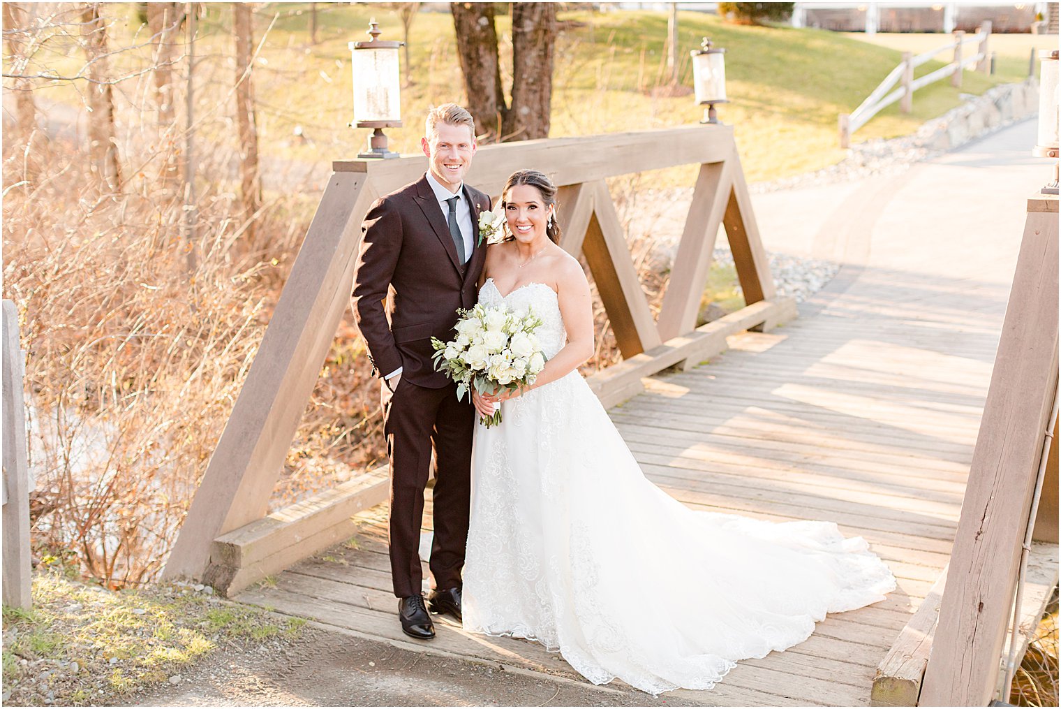 bride and groom hug on bride at Bear Brook Valley