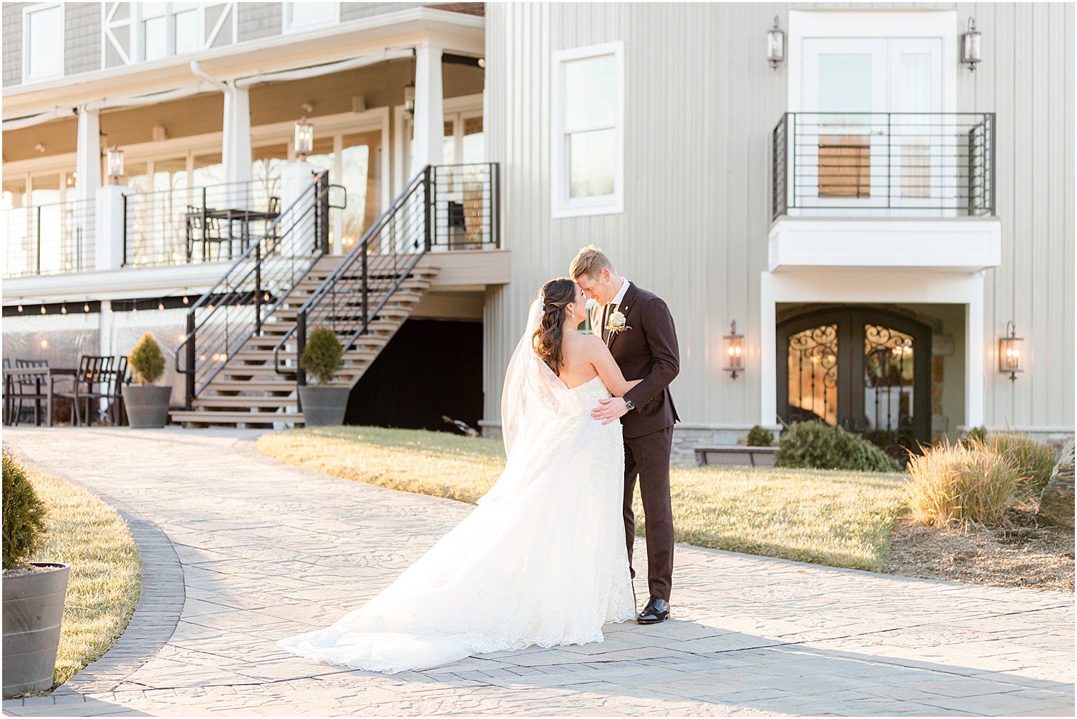 bride and groom stand with foreheads touching at Bear Brook Valley