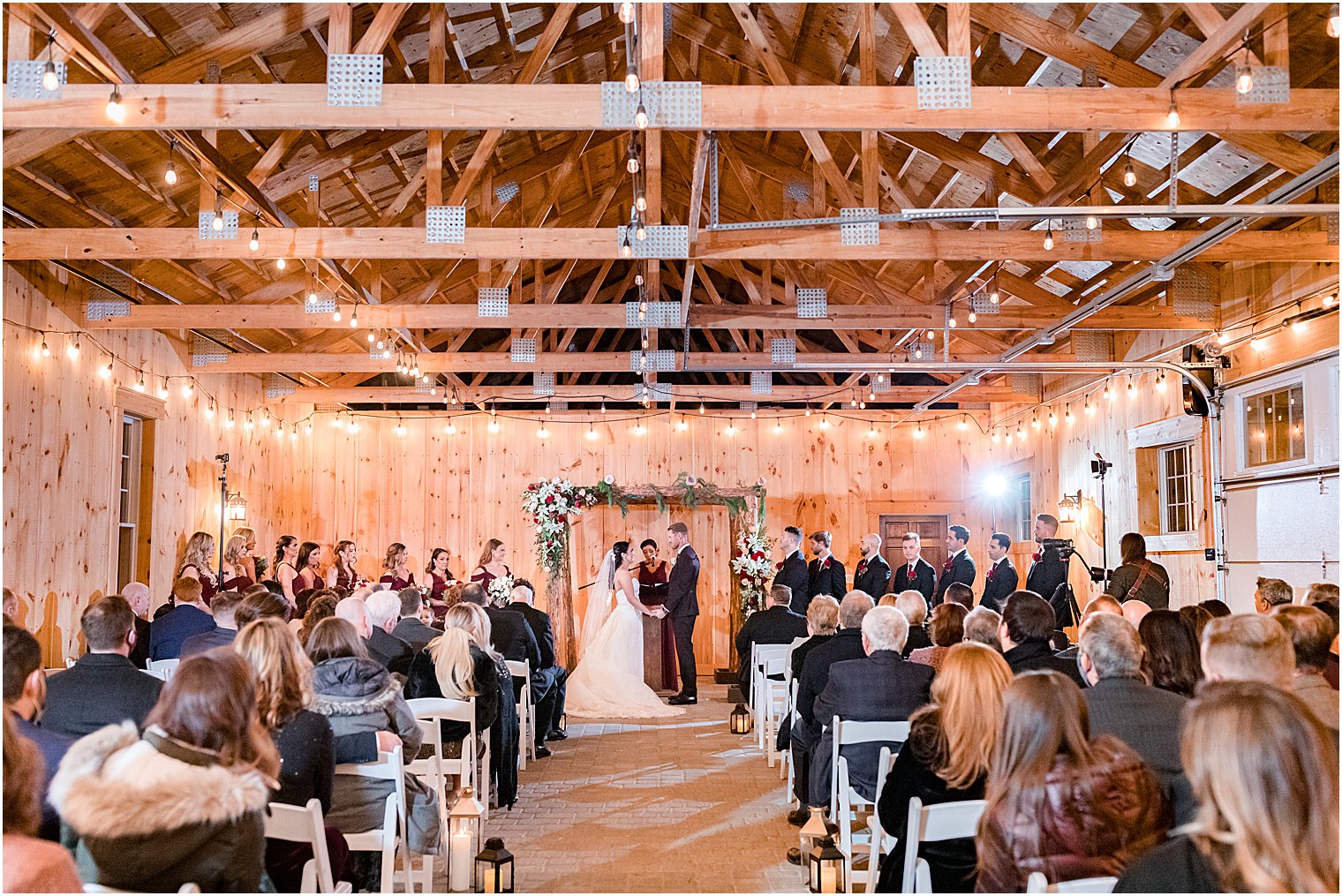 couple exchanges vows during wedding ceremony in farmhouse