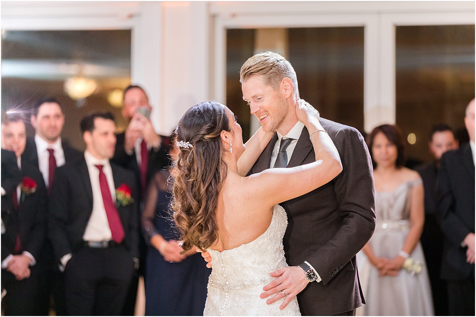 groom smiles at bride during first dance at NJ wedding reception