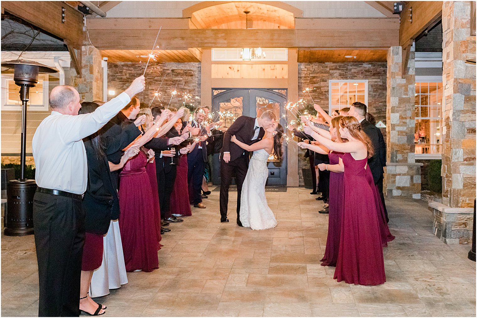 newlyweds kiss during sparkler exit at Bear Brook Valley