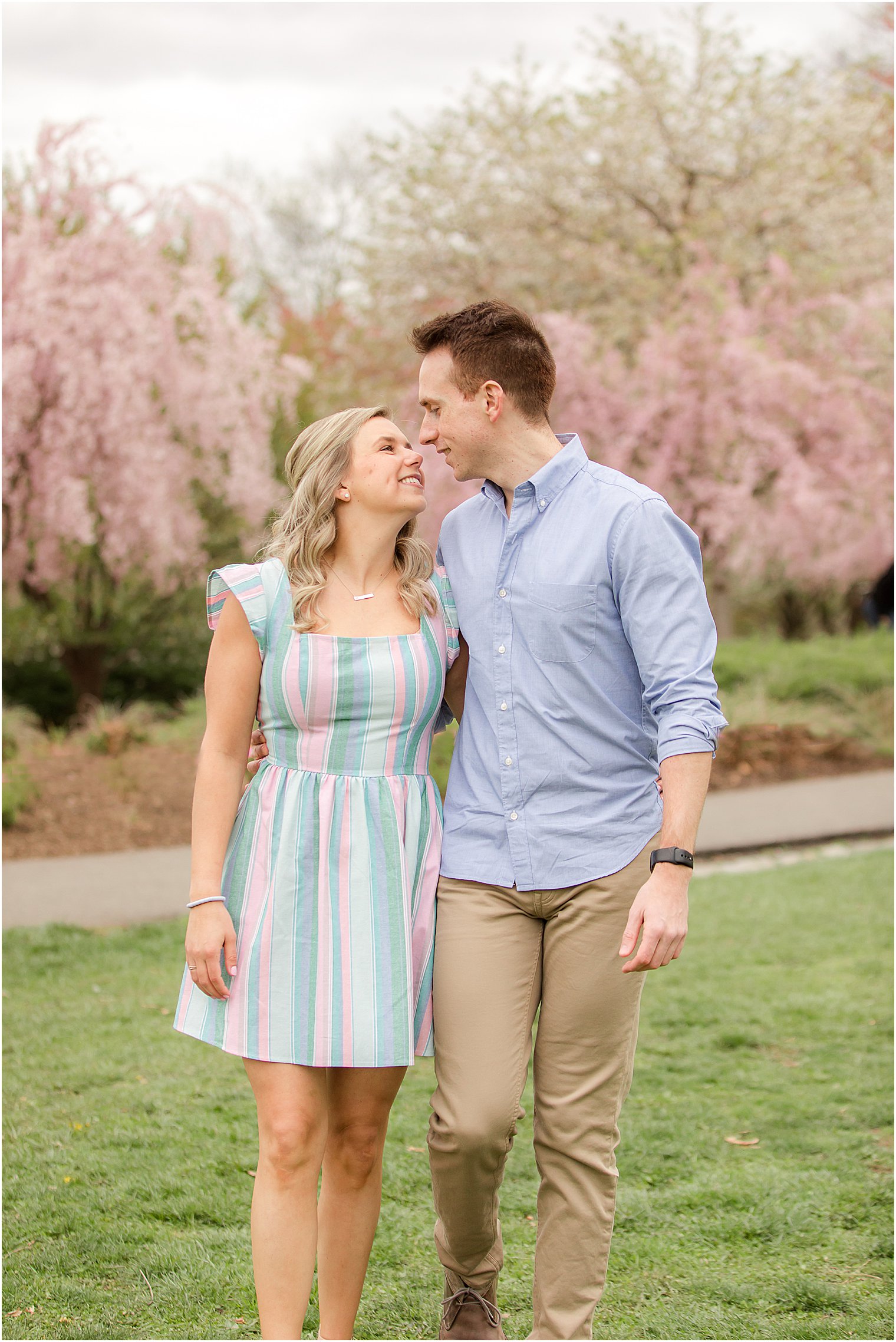 bride and groom kiss during NJ engagement session at Branch Brook Park