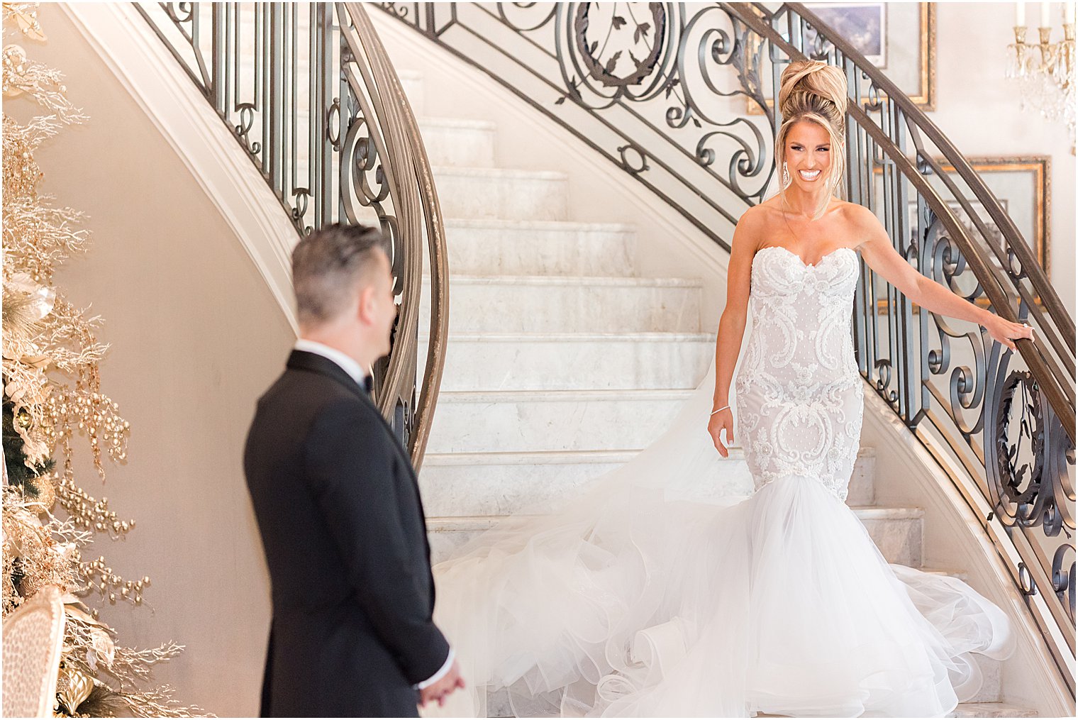 bride walks down steps for first look with dad at Park Chateau Estate 
