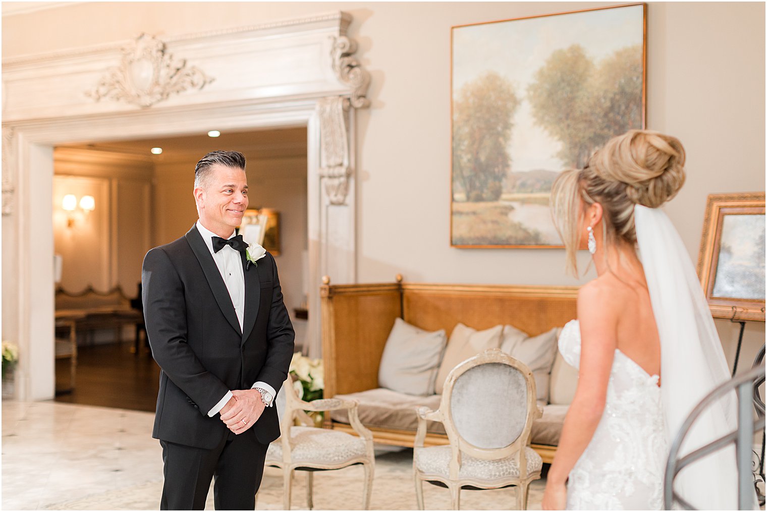 dad smiles at bride during first look before winter wedding day