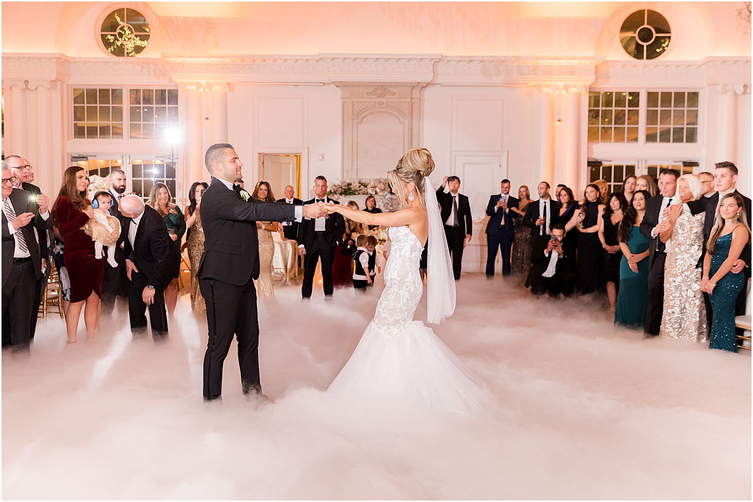 bride and groom have first dance with fog at East Brunswick NJ wedding reception