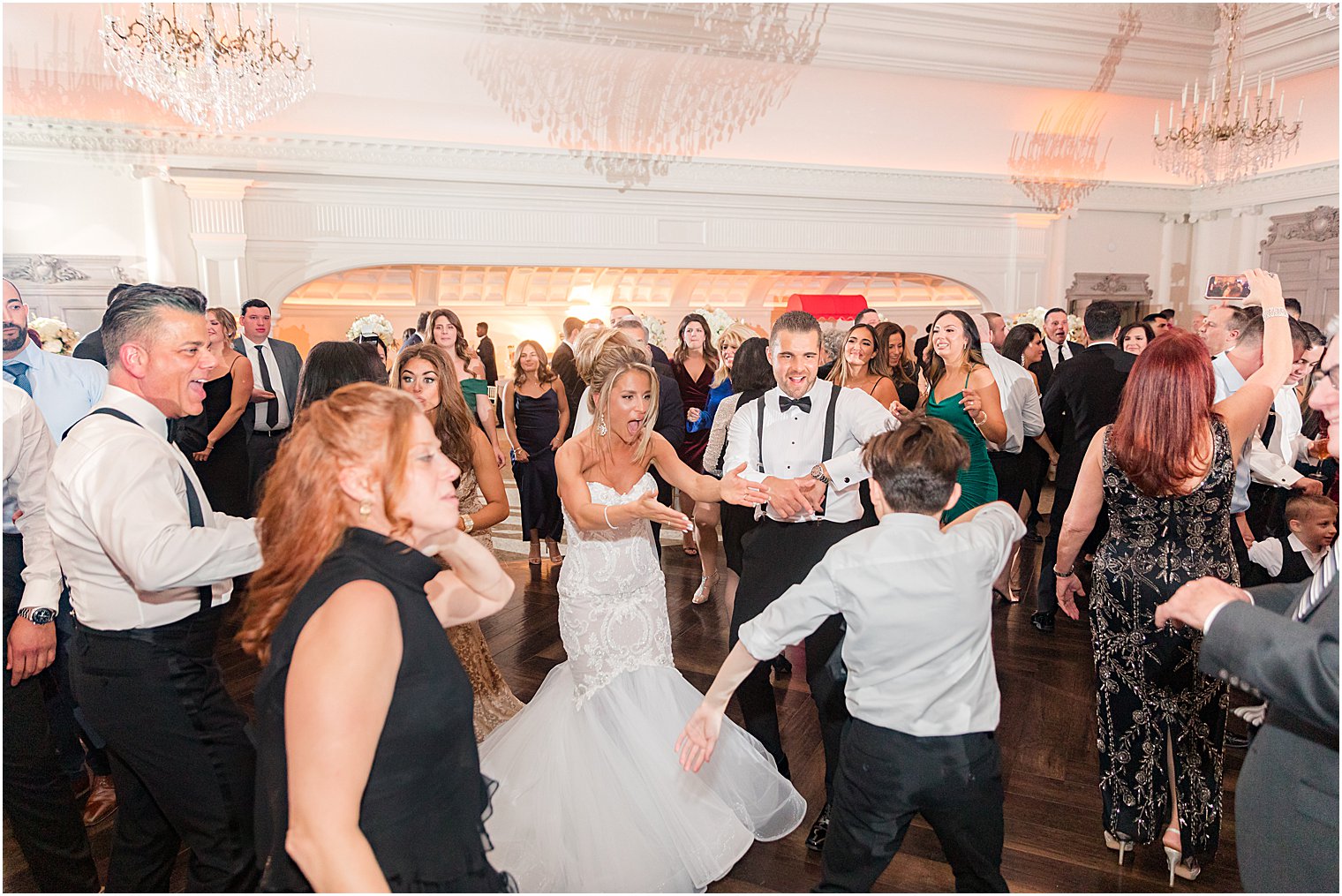 bride and groom dance with wedding guests at East Brunswick NJ wedding reception