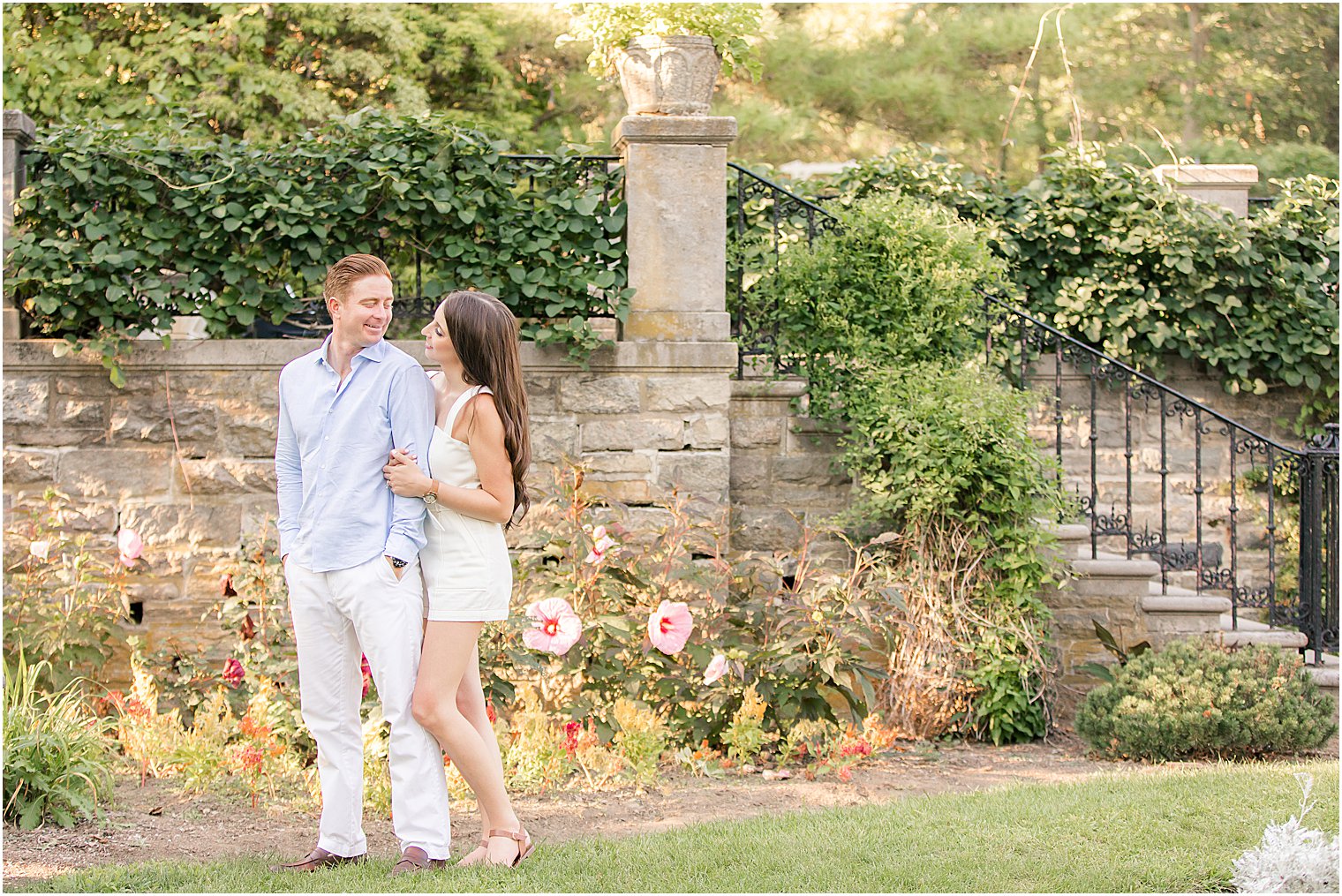 woman holds man's arm during Skylands Manor engagement photos