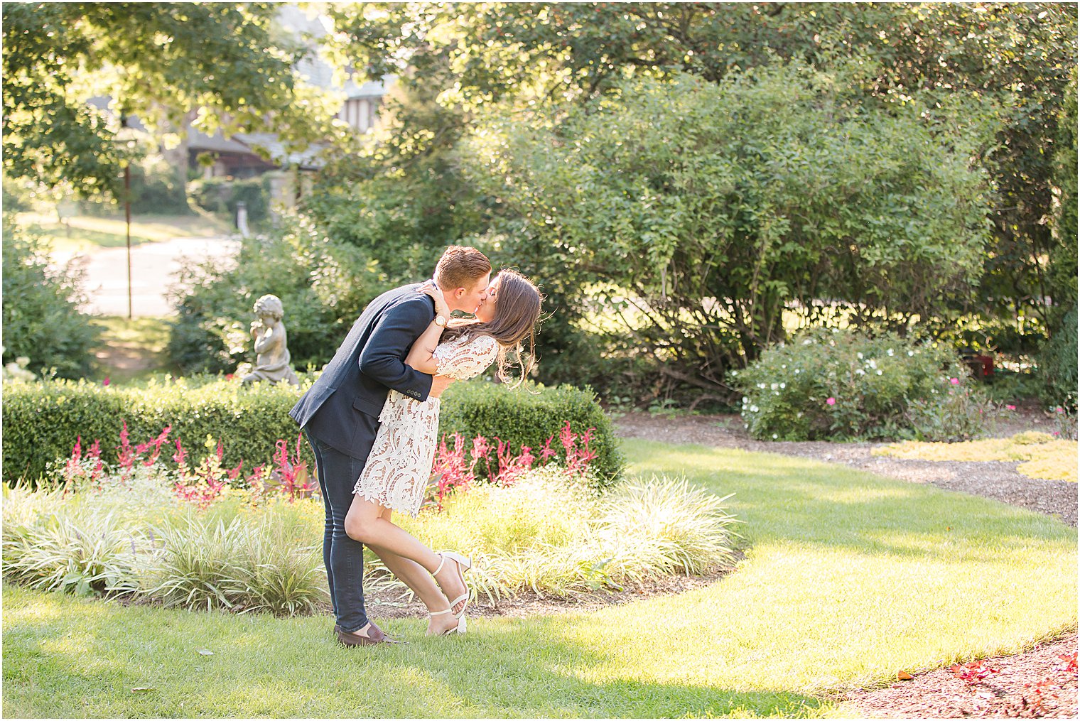 groom kisses bride dipping her backwards during Skylands Manor engagement session
