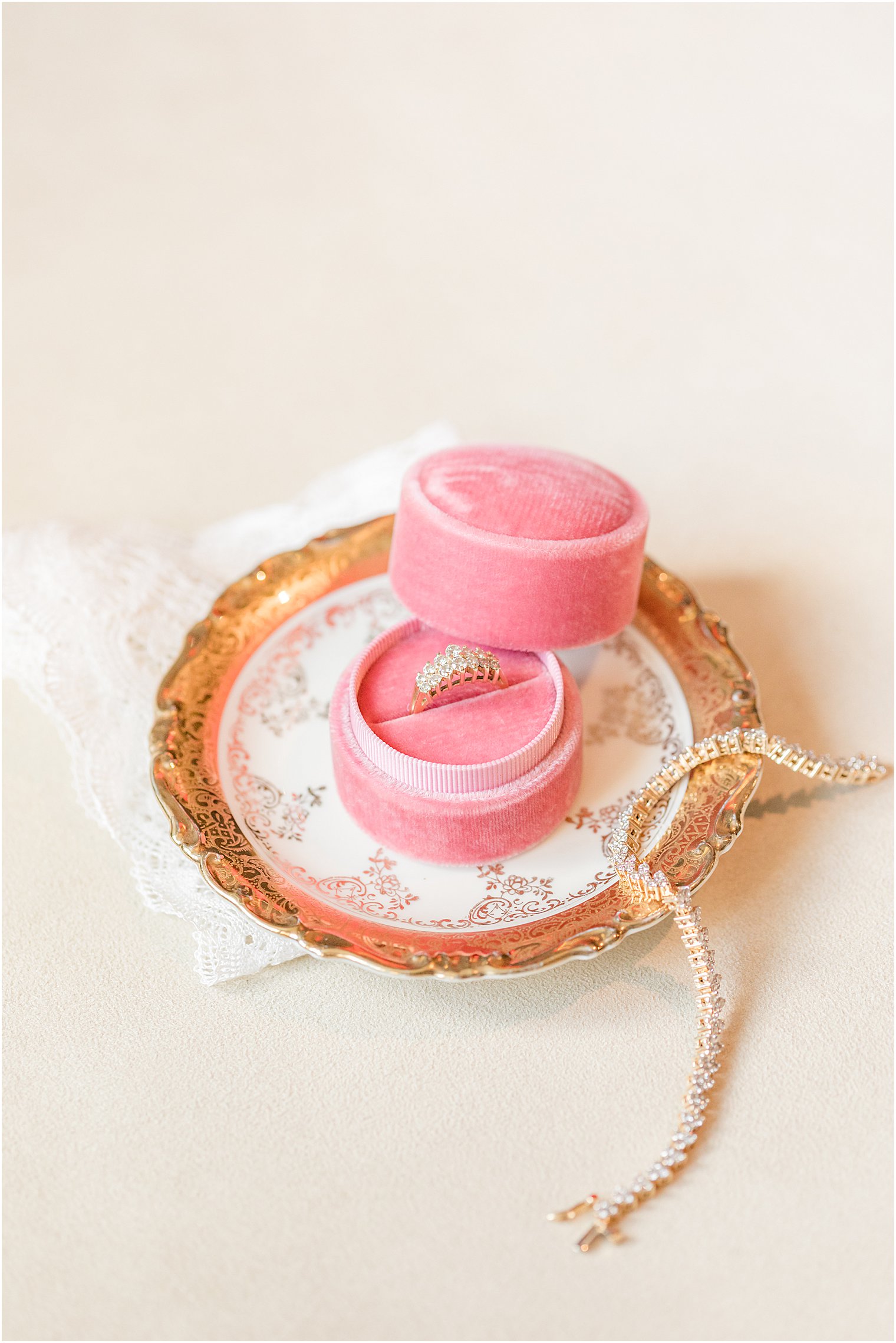 wedding rings rest in pink box at Stone House at Stirling Ridge