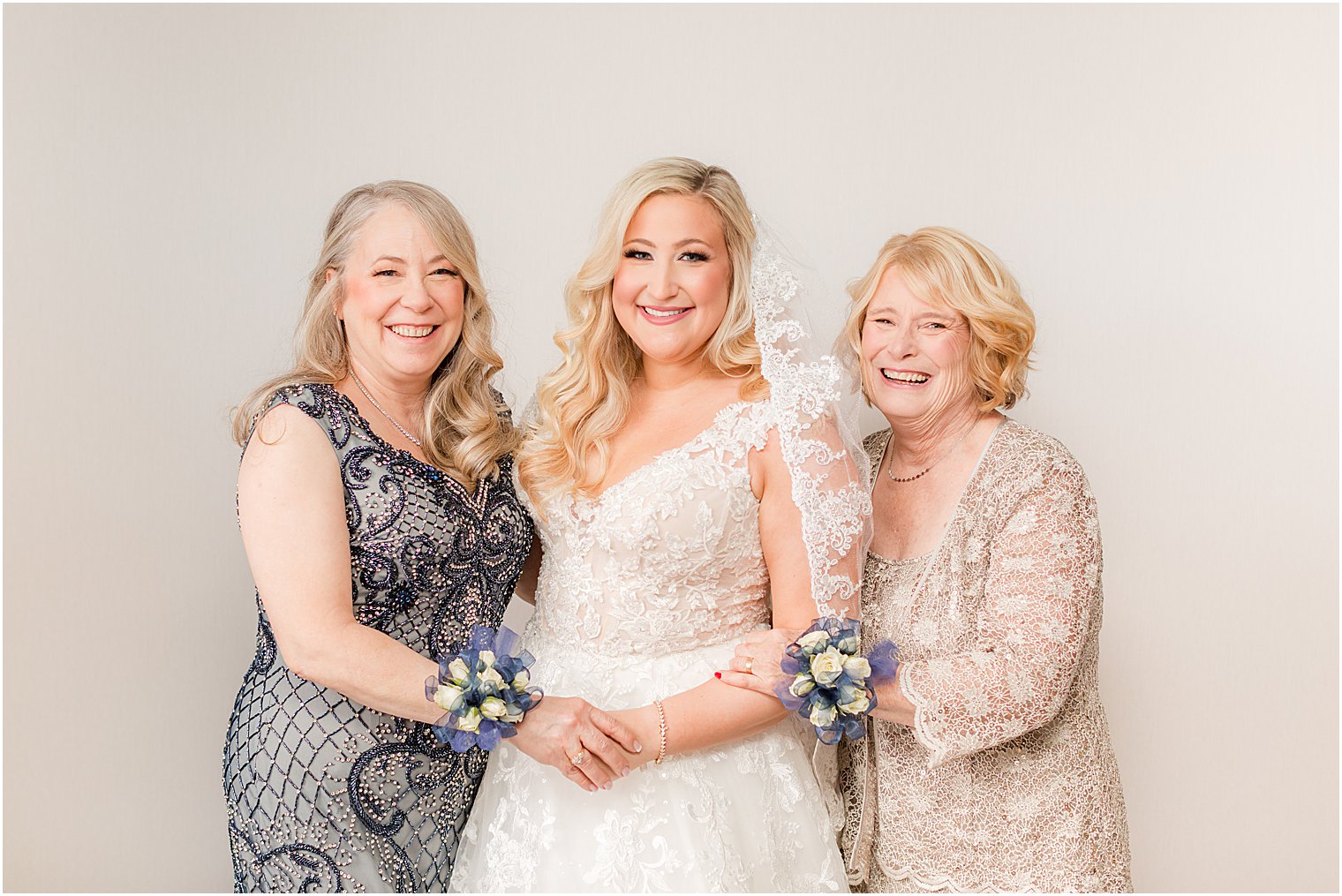 bride poses with mother and grandmother at Stone House at Stirling Ridge
