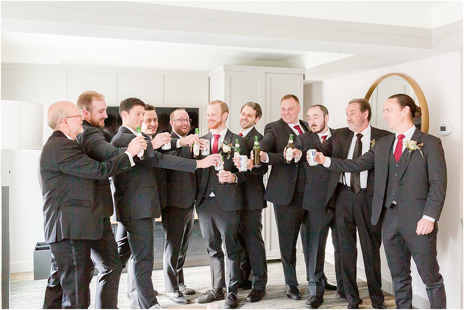 groomsmen toast groom during prep at Stone House at Stirling Ridge