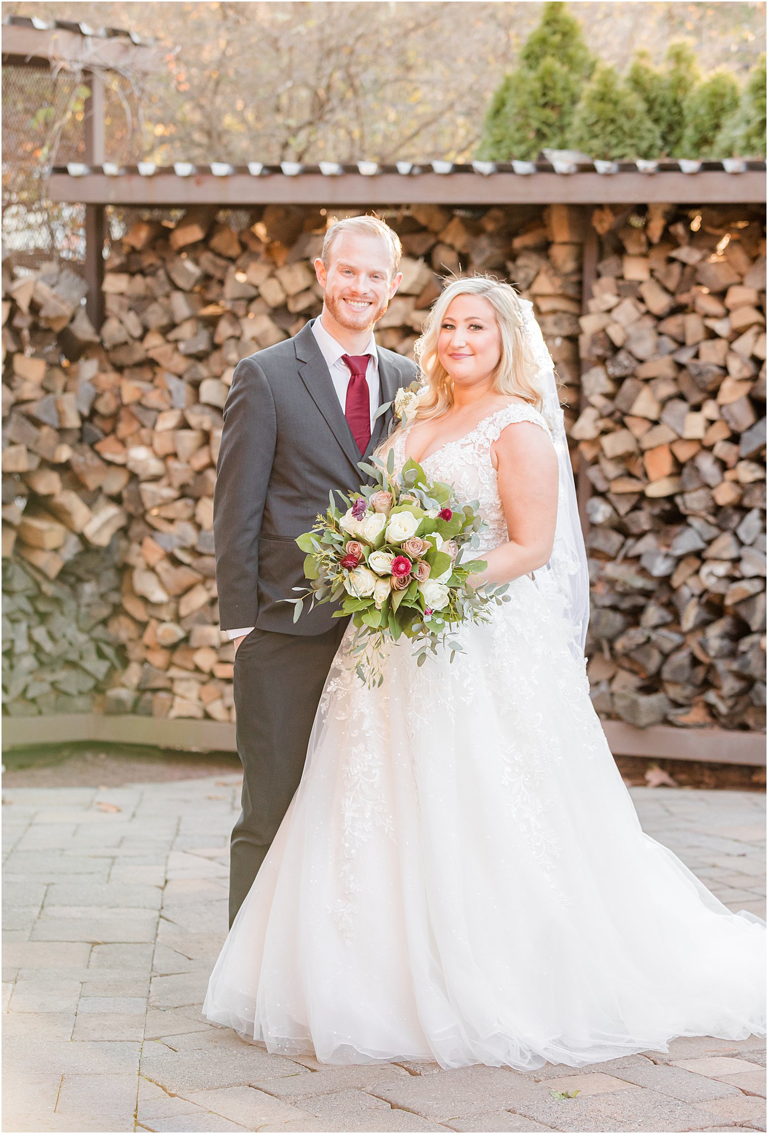 bride and groom pose by wood at Stone House at Stirling Ridge