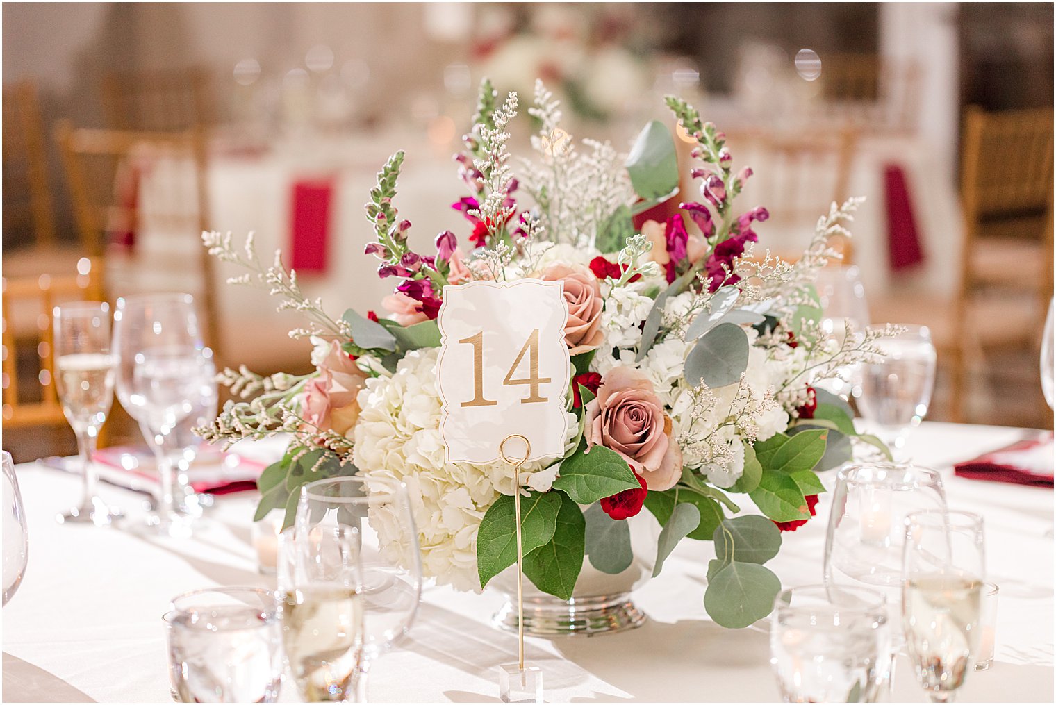 centerpieces with red and white flowers at Stone House at Stirling Ridge Wedding